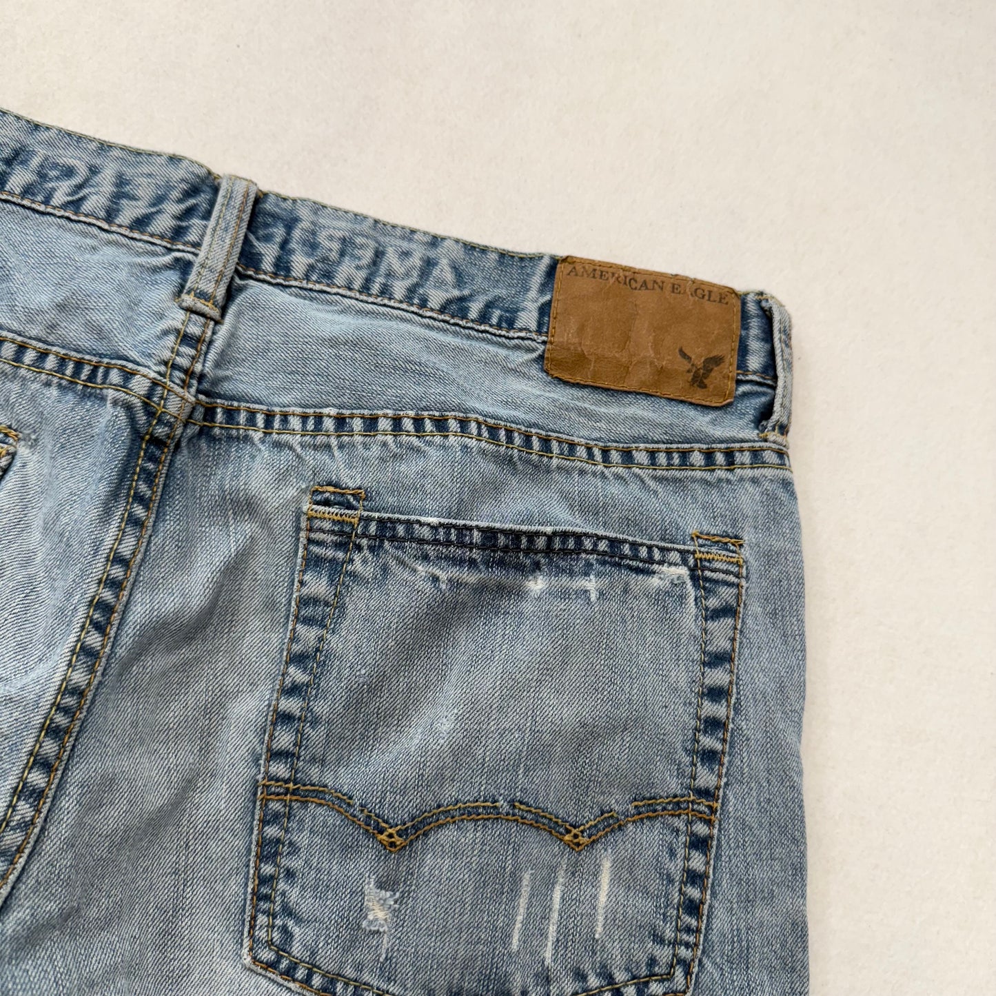 American Eagle Men's Light Wash Blue Denim Straight Leg Jeans Raw Hem Size 34